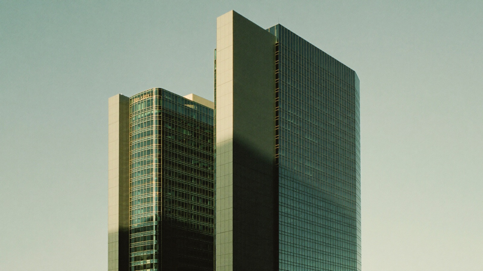 Glass office towers in early morning light